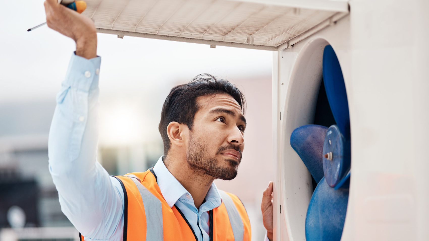 Engineer man, air conditioning and maintenance on roof, industry and inspection with thinking in ci.