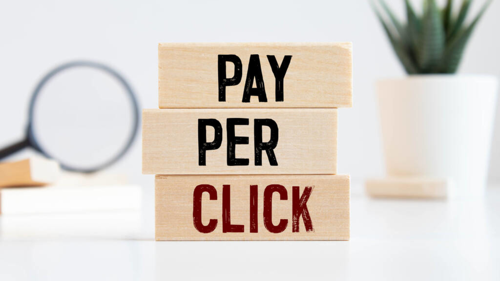 PPC Pay Per Click text on dices on wooden background.