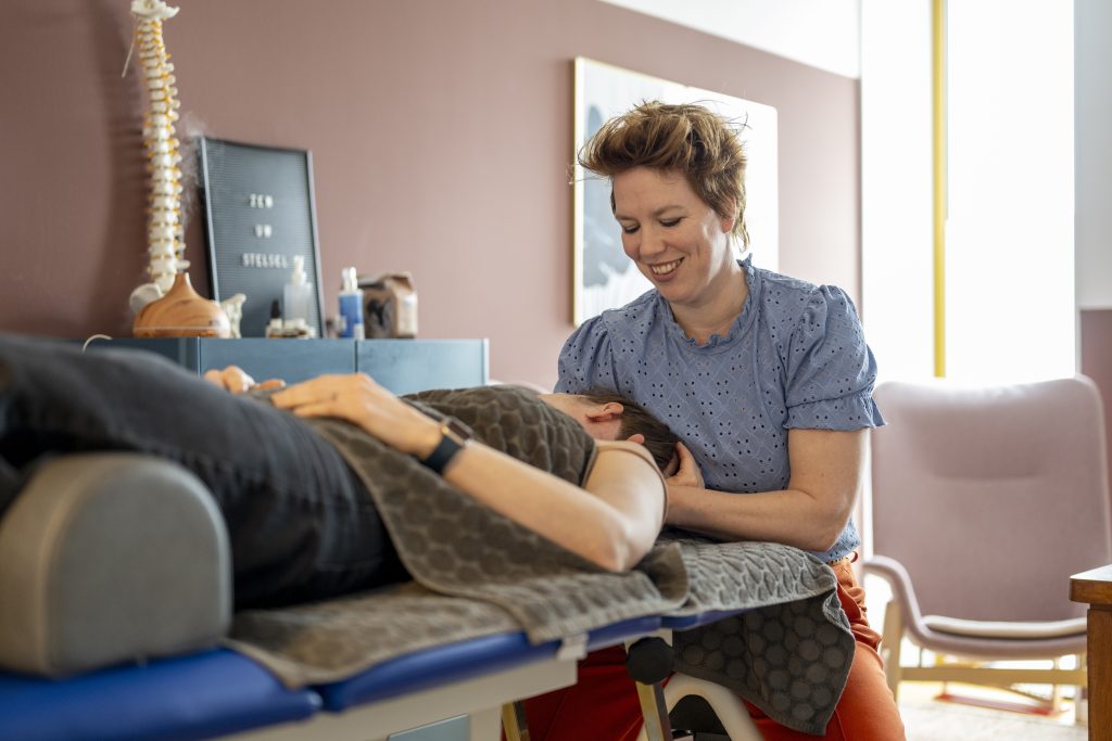 Chiropractor working on a patient in a clinic.